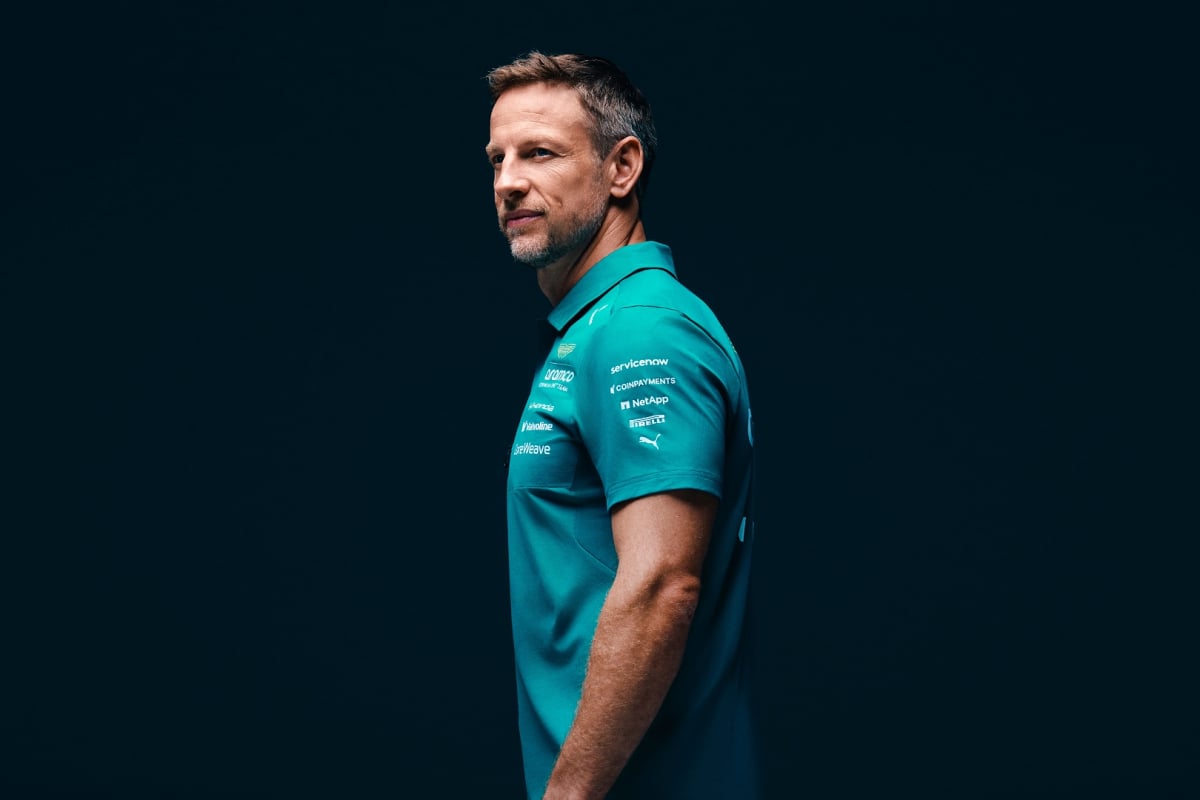 Jenson Button is pictured in Aston Martin teamwear after joining as an ambassador