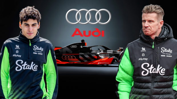 Hulkenberg and Bortoleto stand either side of the Audi F1 car